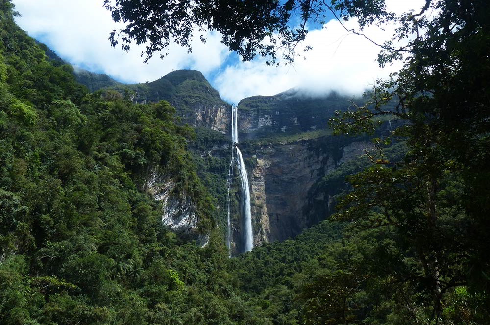 A Sustainable Stay At Gocta Natura Cabins 16 View of Gocta waterfall through the trees